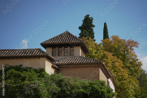 Granada Alhambra traditional spanish building, fortress, palace, stronghold, castle with garden and fountain
