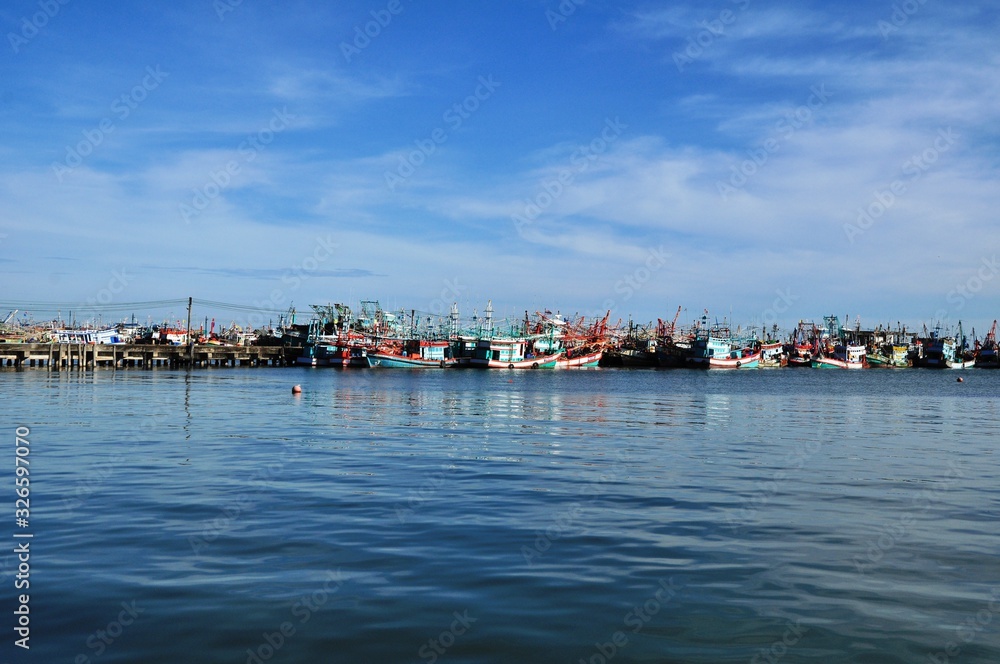View of Thai fishing port on a clear bright day.