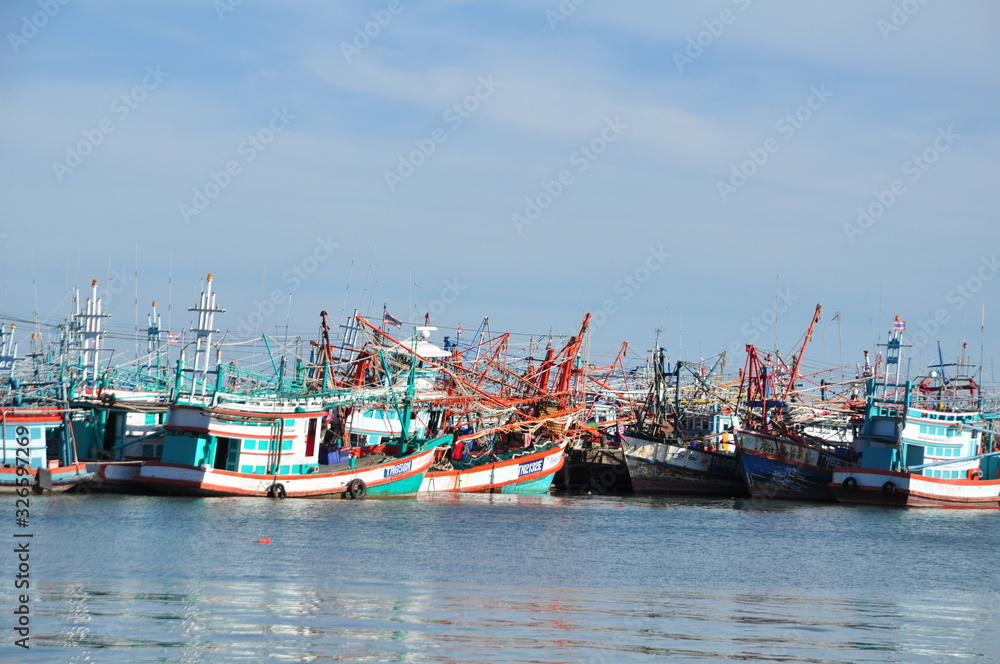 View of Thai fishing port on a clear bright day.