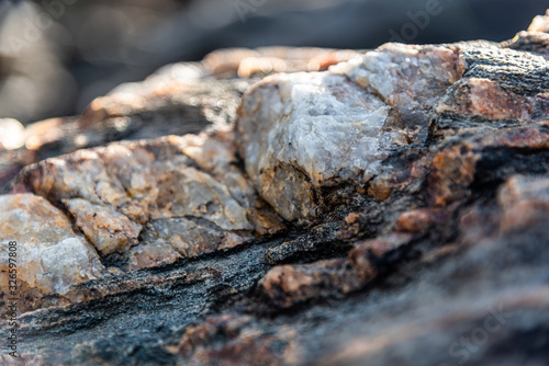 Close Up of Raw Red Granite Scales of the Canadian Shield. Textured Background