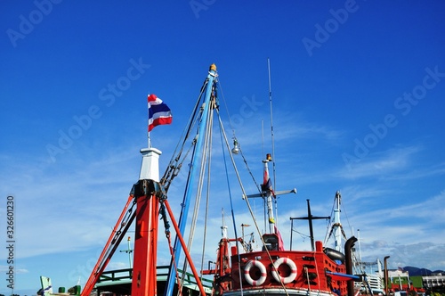 View of Thai fishing port on a clear bright day.	