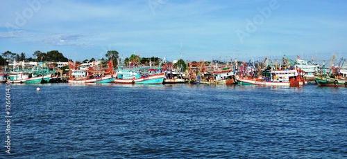 View of Thai fishing port on a clear bright day. 