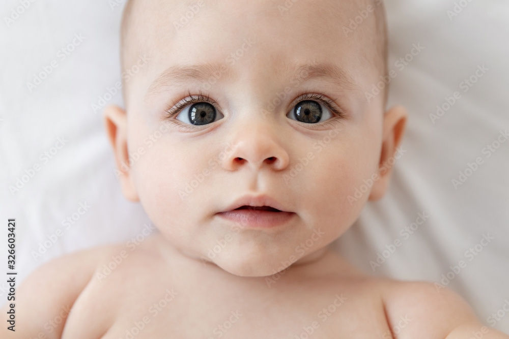 Close up of cute baby face looking at camera Close up of cute baby face looking at camera