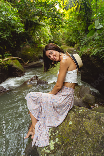 Happy woman on excurssion to wild river stock photo