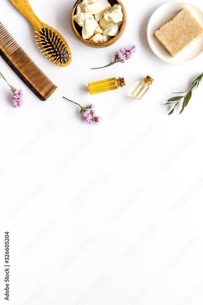 Cosmetics for hair care with argan and jojoba oil on white background top-down frame copy space Cosmetics for hair care with argan and jojoba oil on white background top-down frame copy space