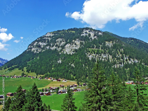 An old tourist-livestock alpine settlement in the Saminatal valley and along an artificial lake Gänglesee (Ganglesee or Gaenglesee) - Steg, Liechtenstein photo