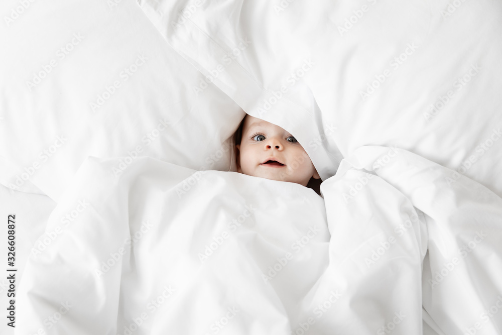 Overhead view of baby surrounded in white blankets Overhead view of baby surrounded in white blankets