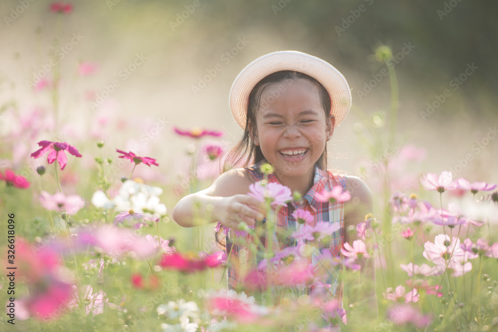 traveler or tourism. happy little asian girl child in cosmos flower fields with big smile and laughing healthy happy funny smiling face young adorable lovely female kid. happy lifestyle concept. traveler or tourism. happy little asian girl child in cosmos flower fields with big smile and laughing healthy happy funny smiling face young adorable lovely female kid. happy lifestyle concept.