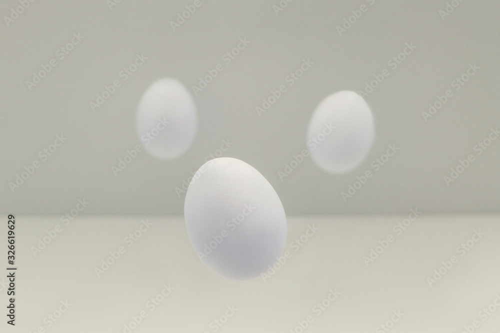 Flying easter white eggs on white background.