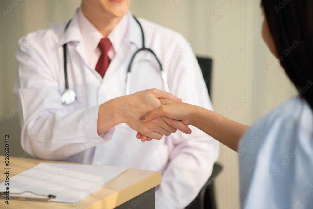 Asian Doctor and patient talking and checking health care medicall sickness at hospital Asian Doctor and patient talking and checking health care medicall sickness at hospital