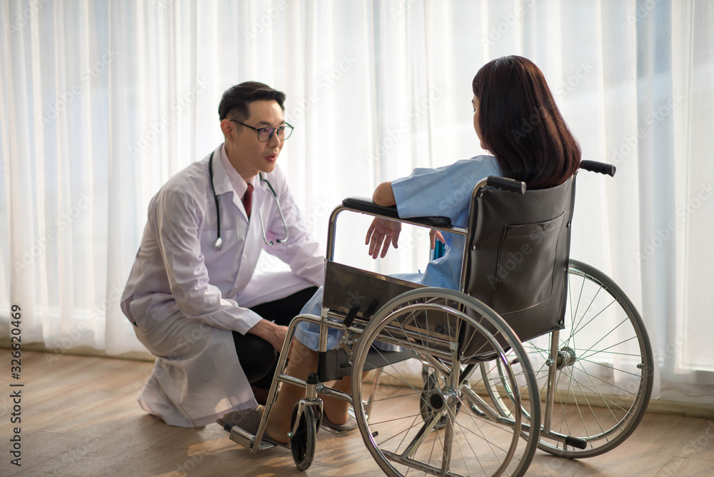 Asian Doctor and patient talking and checking health care medicall sickness at hospital Asian Doctor and patient talking and checking health care medicall sickness at hospital