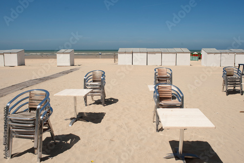 bath cabins and lounge chairs on the beach at De Panne in Belgium