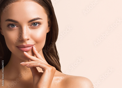 Beautiful woman hand touching skin manicure nails tanned skin natural make up clen fresh body care