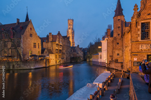 Panoramic city view with Belfry tower and famous canal in Bruges, Belgium.