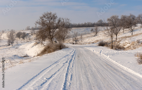 Winter landscape with country slippery road near Novonikolaevka village, in central Ukraine © Yuri Kravchenko