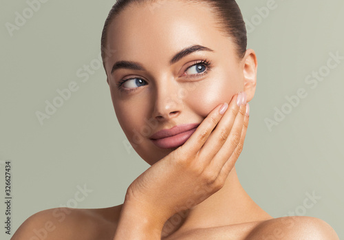 Bild auf Leinwand Beautiful woman face close up manicure nails hand touching skin  beauty make up