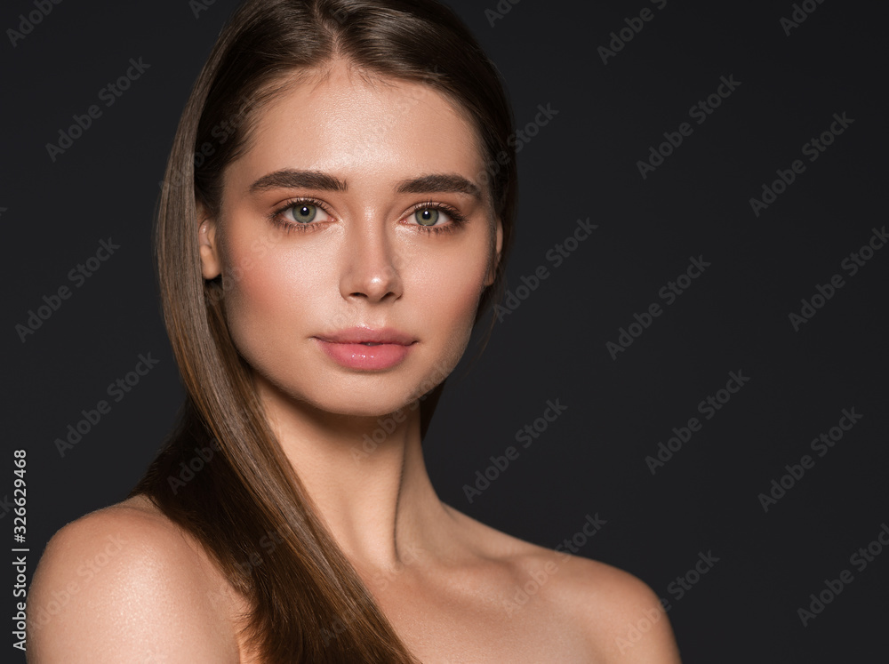 Beautiful woman natural make up long smooth healthy hair brunette cosmetic concept female beauty skin care over black background Beautiful woman natural make up long smooth healthy hair brunette cosmetic concept female beauty skin care over black background