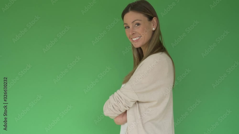 Portrait of beautiful and cheerful woman on green background, isolated Portrait of beautiful and cheerful woman on green background, isolated