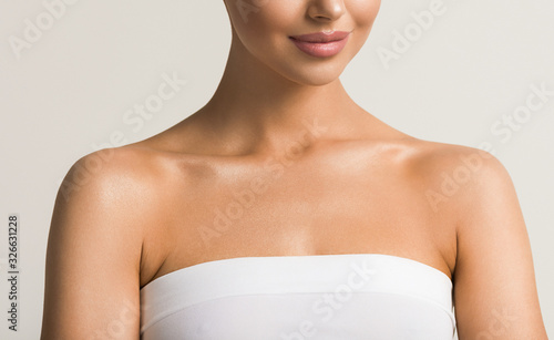 Beautiful woman body neck shoulders lips healthy skin cosmetic tanned skin care female model