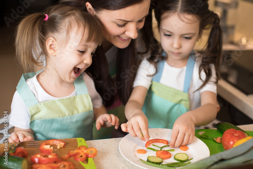 Cute mom and her kids prepa...