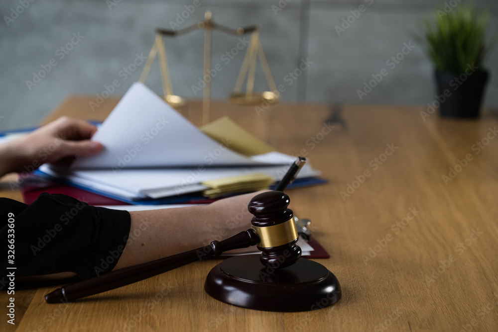 female lawyer working at the law firms. Judge gavel with scales of justice. Legal law, lawyer, advice and justice concept. female lawyer working at the law firms. Judge gavel with scales of justice. Legal law, lawyer, advice and justice concept.