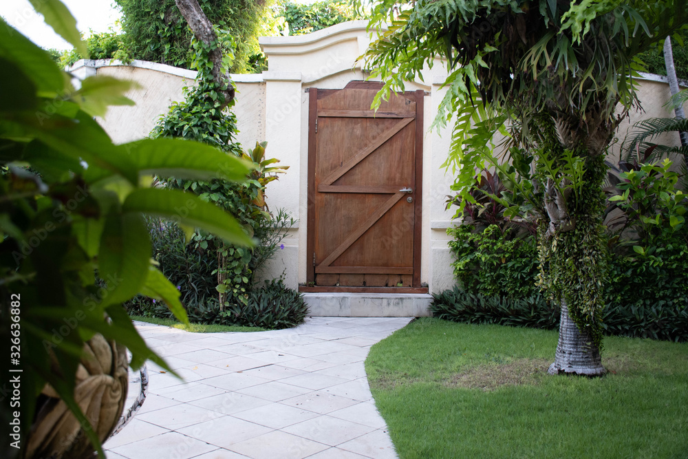 Wooden door in the garden Wooden door in the garden