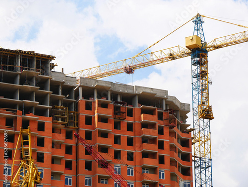 Construction site background. Crane near building.