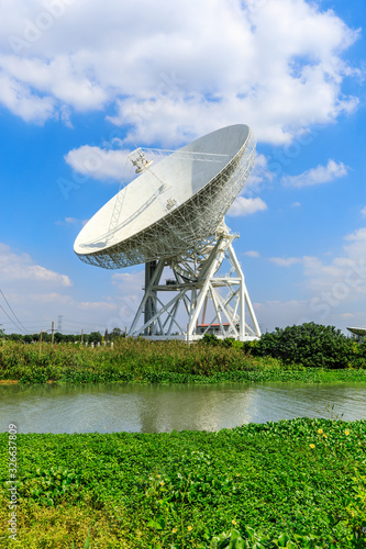 Observatory radio telescope under the blue sky in Shanghai.