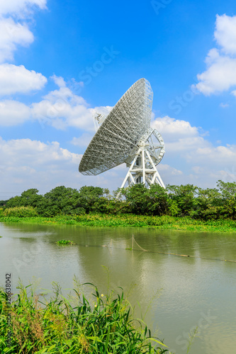 Observatory radio telescope under the blue sky in Shanghai.