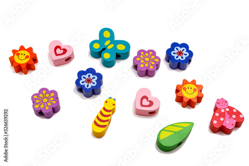 Top view with colorful wooden baby toys on isolated white background.