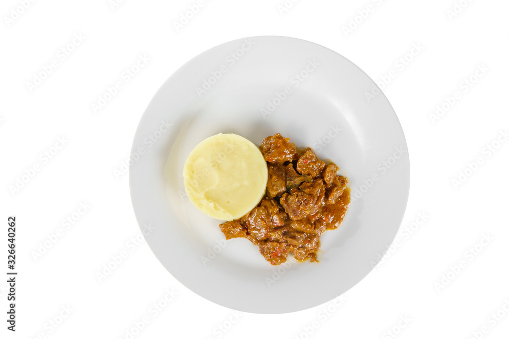 goulash from beef, pork, lamb meat with side dish mash potato on a plate isolated white background. Juicy fillet, roast. For the menu bar, restaurant, cafe View from above goulash from beef, pork, lamb meat with side dish mash potato on a plate isolated white background. Juicy fillet, roast. For the menu bar, restaurant, cafe View from above