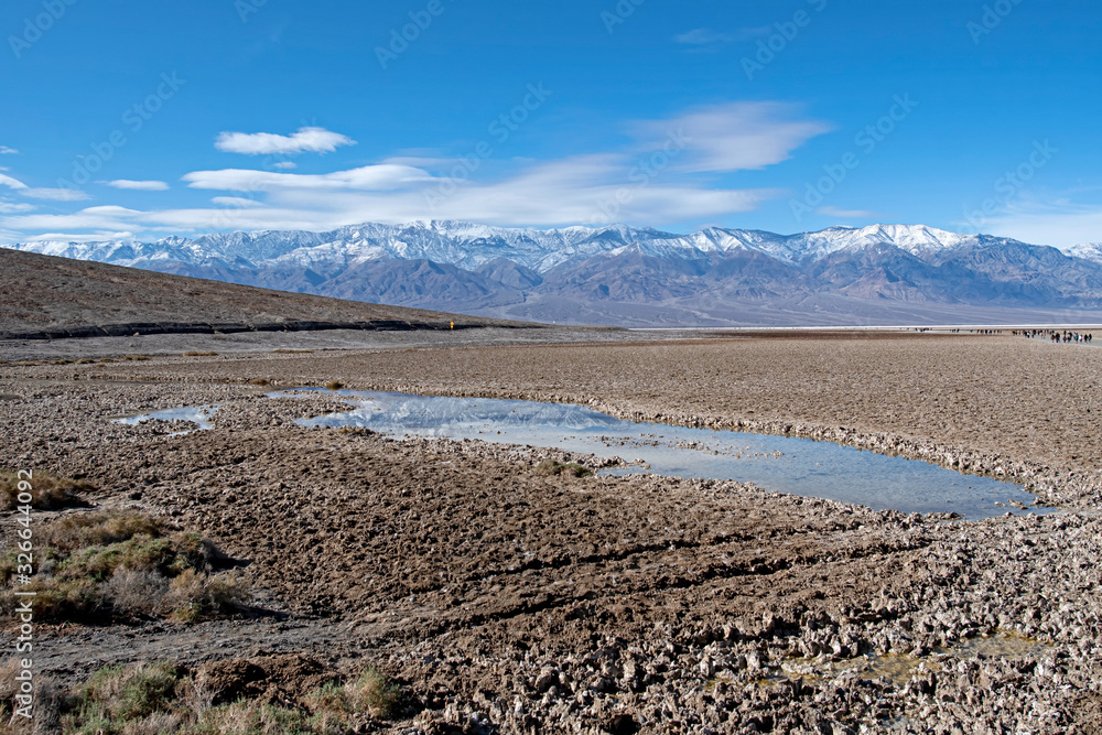 Reflection of swony mountain - below sea level in Bad Water - Death Valley - USA