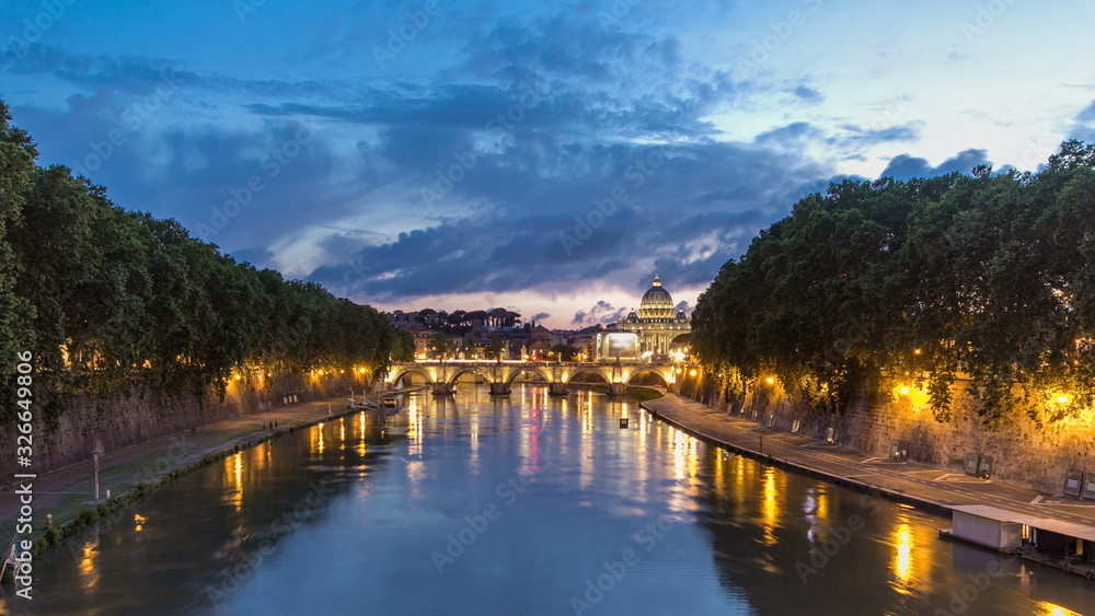 Fototapeta premium Rome, Italy: St. Peter's Basilica, Saint Angelo Bridge and Tiber River after the sunset day to night timelapse