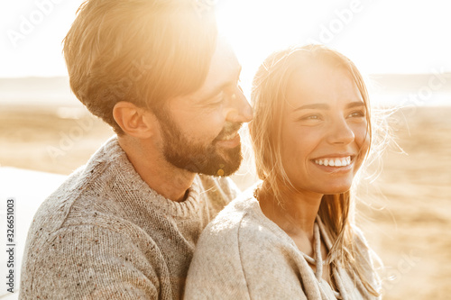 Close up of a smiling beautiful young couple photo