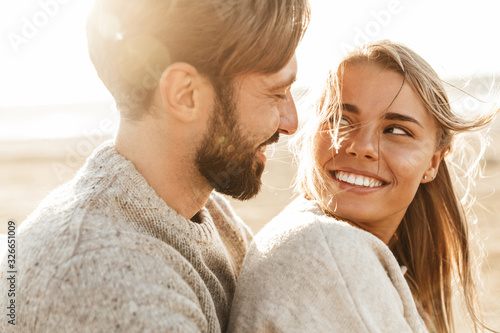 Close up of a smiling beautiful young couple photo
