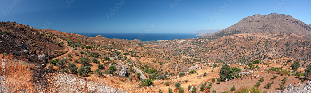 Panoramic view of the mountainous and wild landscape of the southern coast of Crete in Greece.