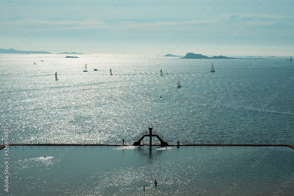 Beautiful scenery of sea water swimming pool at Plage du Bon Secours on late afternoon, St-Malo landmark, Brittany, France. - obrazy, fototapety, plakaty 