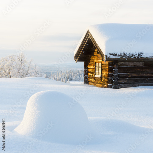Wooden cabin in the mountains in winter