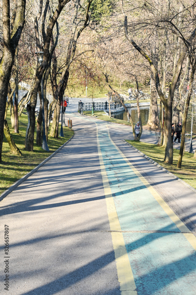 bicycle track drawn on a valley road from Alexandru Ioan Cuza Park in Bucharest.movement for a healthy lifestyle bicycle track drawn on a valley road from Alexandru Ioan Cuza Park in Bucharest.movement for a healthy lifestyle
