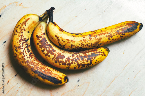 Ripe yellow bananas fruits, bunch of ripe bananas with dark spots on a white background with clipping path...