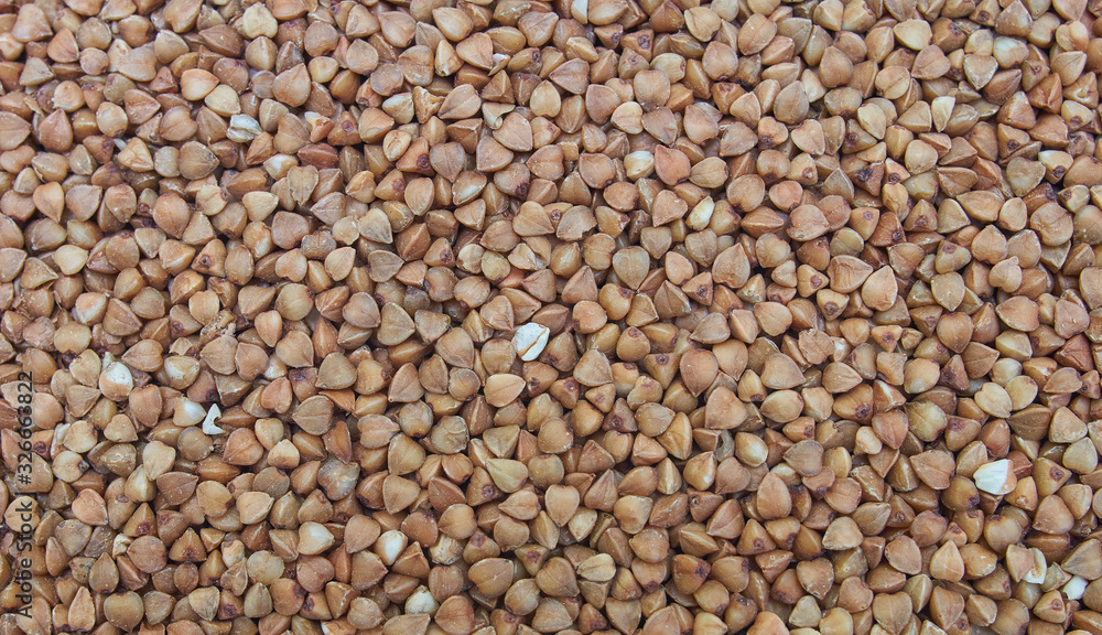 Buckwheat grains, brown seeds, background, texture. Grechka Buckwheat grains, brown seeds, background, texture. Grechka