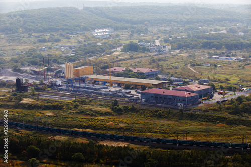 Industrial photography. Panoramic survey of the Factory for the production of reinforced concrete structures on the banks of the picturesque river