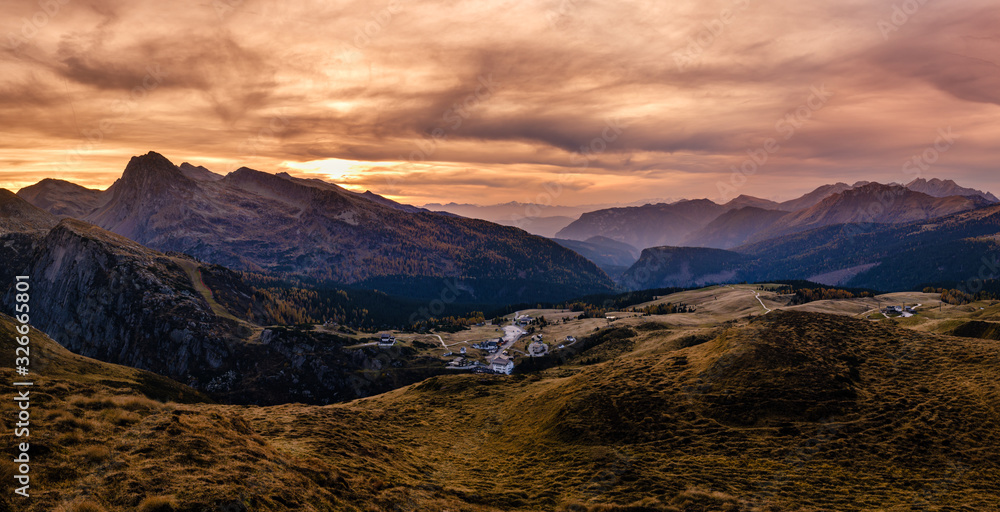 Evening twilight autumn alpine Dolomites mountain scene, Trento, Italy. View from Lake or Laghetto Baita Segantini.