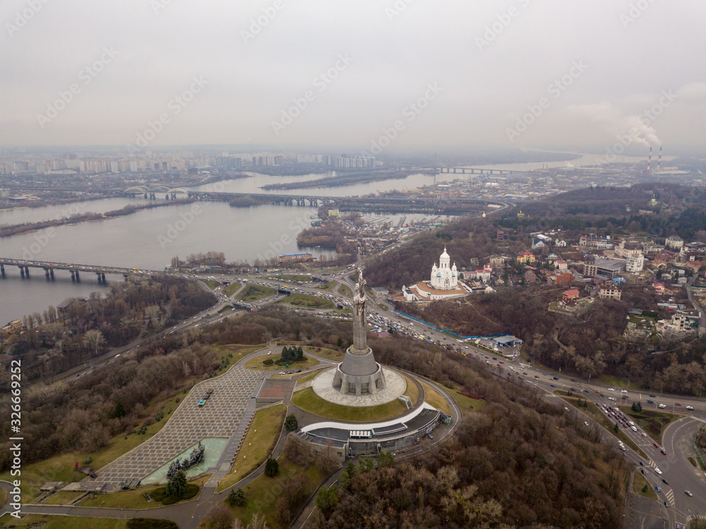 Aerial drone view. View of the Dnieper River in Kiev and the Motherland Monument.