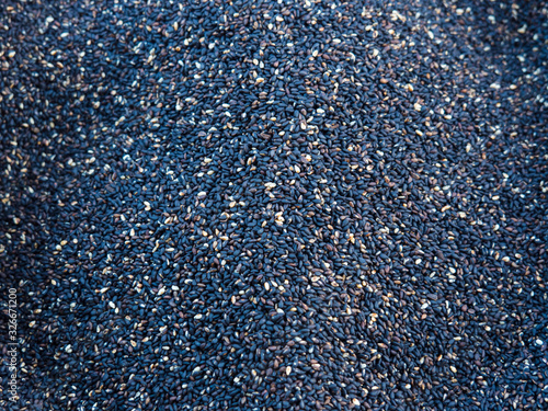 A large number of black and white peeled seeds.