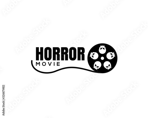 movie slide reel  with big eyes as an alien skull head showing horror movie logo