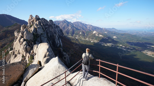 Traveller on the top of Ulsanbawi mountain in a Seoraksan National Park in South Korea, Asia.	
