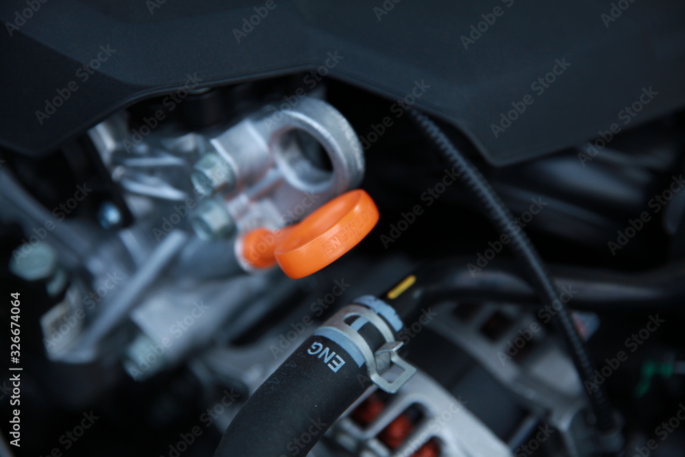 Close up image of car's orange dipstick. Checking engine oil. Close up image of car's orange dipstick. Checking engine oil.