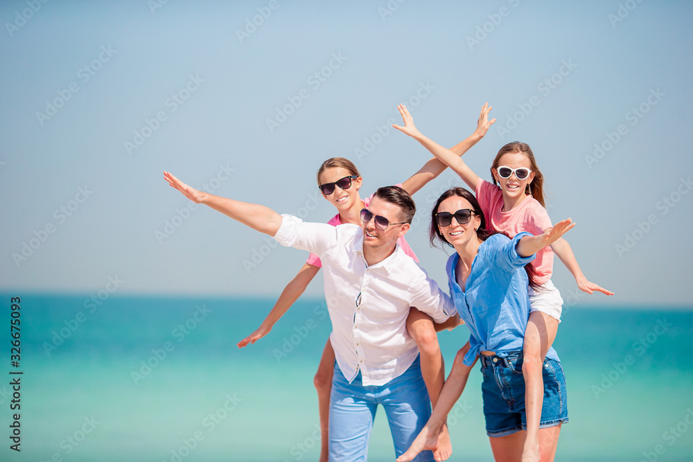 Happy family on the beach during summer vacation Happy family on the beach during summer vacation