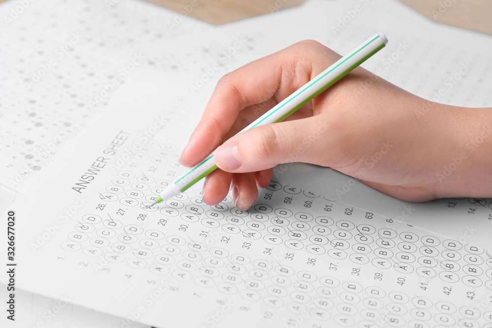 Girl passing school test, closeup Girl passing school test, closeup